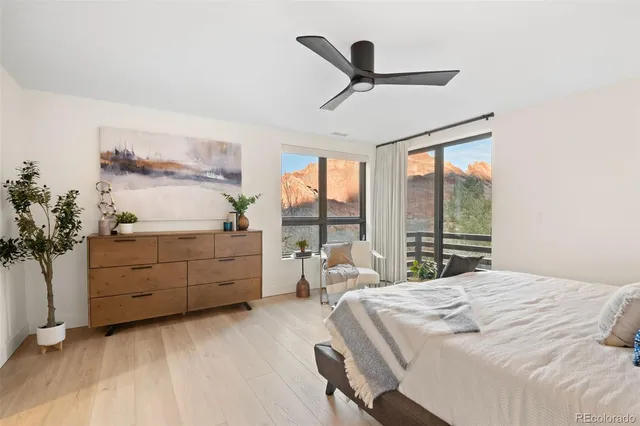 a bathroom with a granite countertop sink mirror and toilet