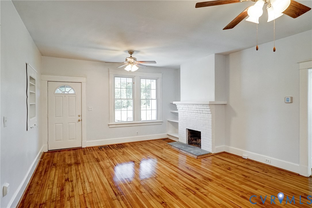 10024 Washington Road Glen Allen, VA 23060 - Photo 17 of 47 Hardwood flooring throughout, a white brick firepl