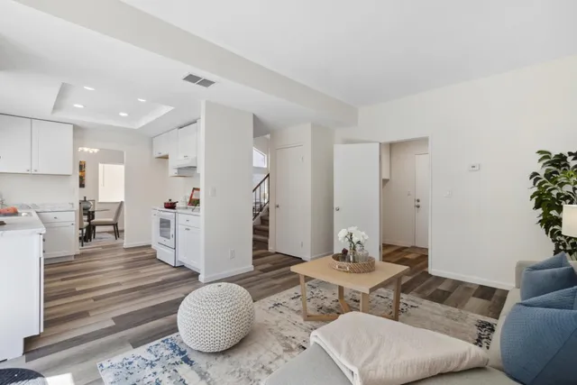 a living room with furniture and a table