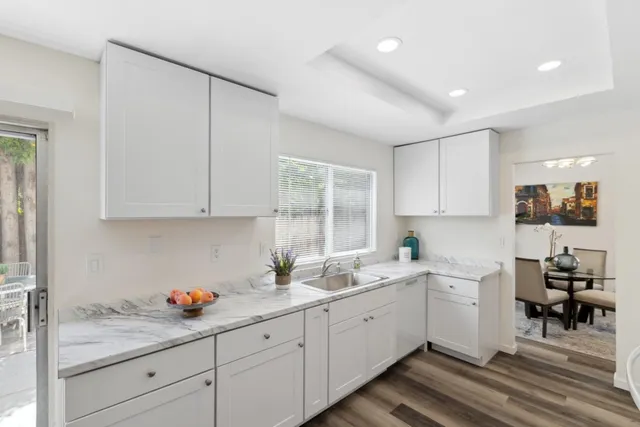 a kitchen with a sink and cabinets