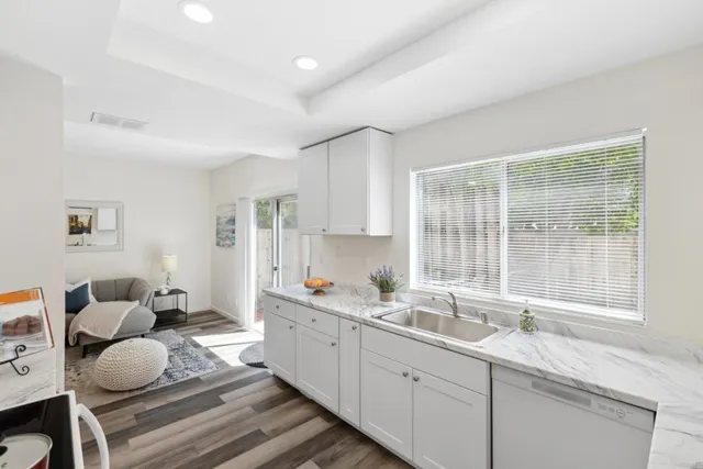 a kitchen with a sink and a window
