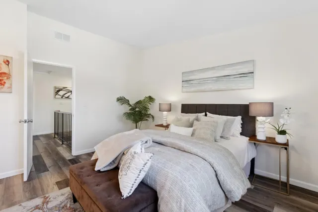 a bedroom with a bed and dresser