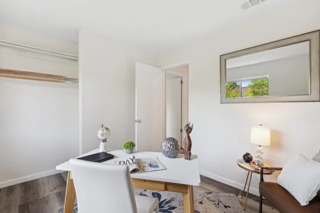 a view of a workspace with furniture