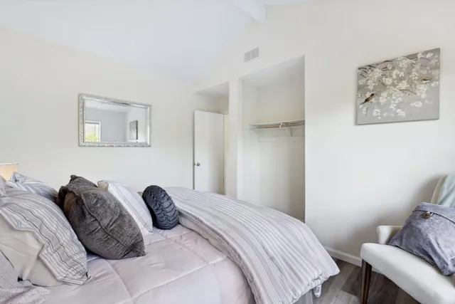 a bedroom with a bed and a chair