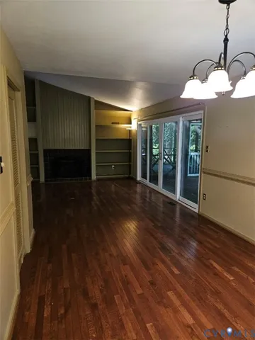 a kitchen with a refrigerator sink and cabinets