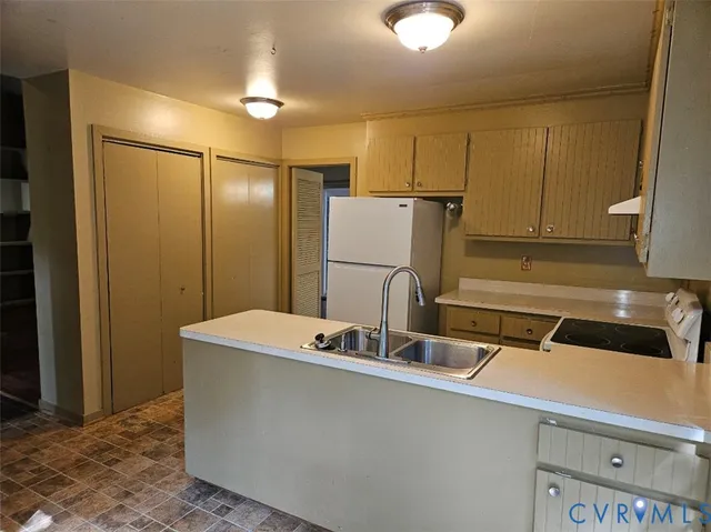 a bathroom with a sink a mirror and a shower
