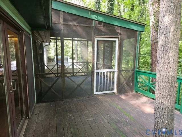 a view of a deck with a forest