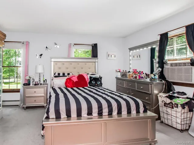 a bathroom with a sink a toilet and shower curtain