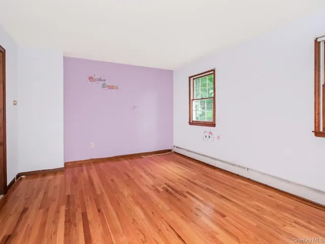 a bathroom with a sink toilet and mirror