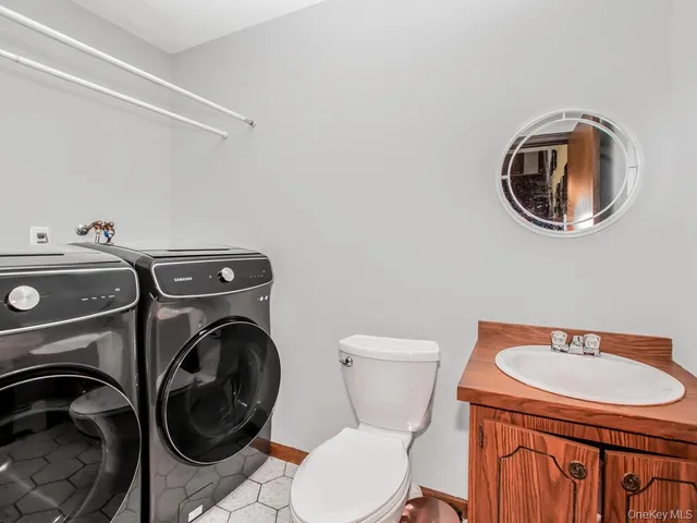 a living room with fireplace furniture and a flat screen tv