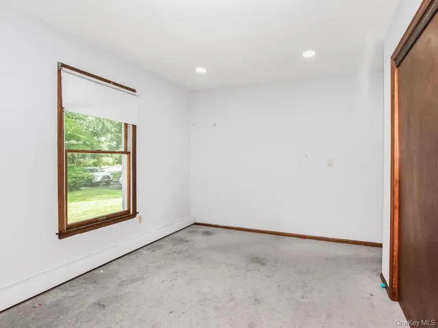 a bathroom with a toilet a sink and a mirror