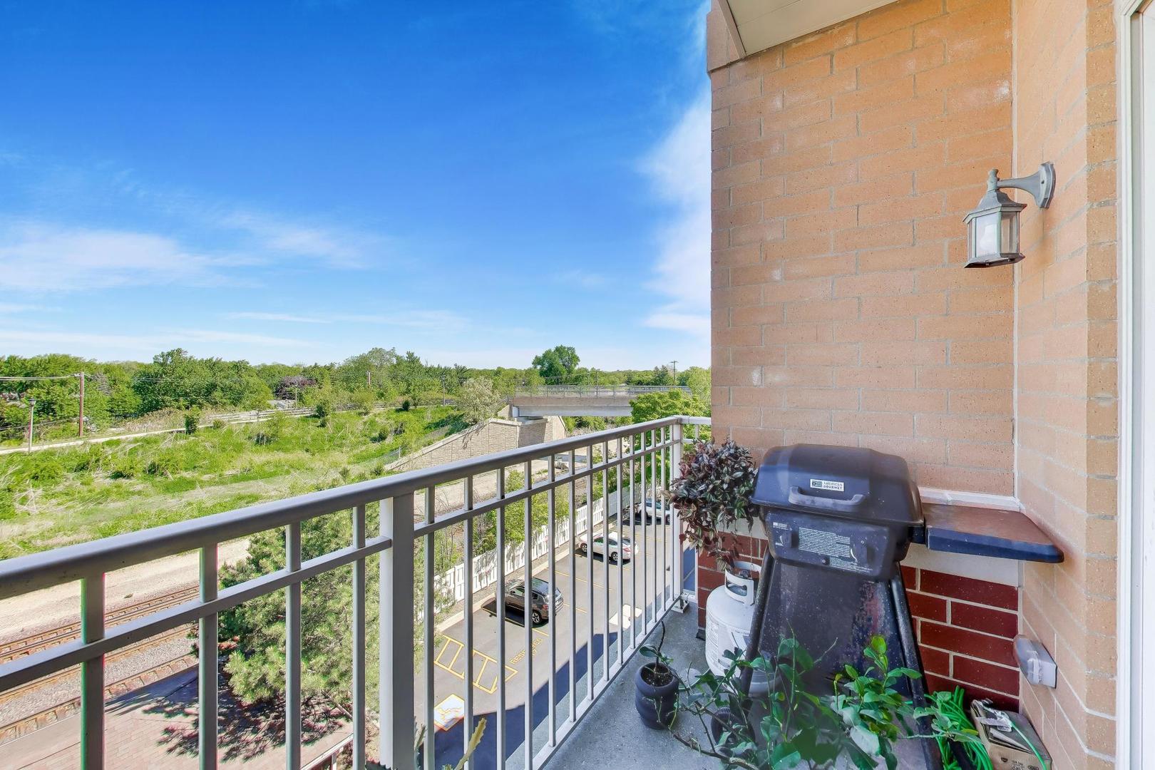 500 East St Charles Road, Unit 510 Lombard, IL 60148 - Photo 21 of 28 a view of a balcony with furniture
