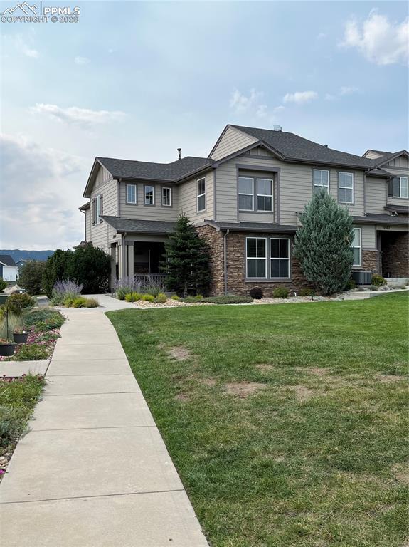 17063 Blue Mist Grove Monument, CO 80132 - Photo 29 of 33 a front view of house with yard and green space