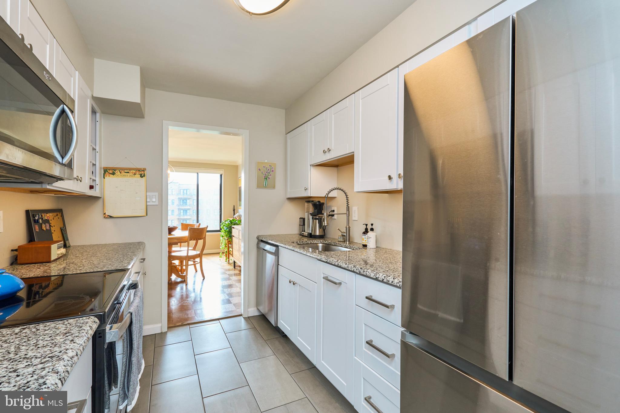2501 Calvert Street Northwest, Unit 809 Washington, DC 20008 - Photo 11 of 33 appliances and light streaming in from