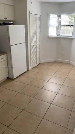 a view of a kitchen with storage and utility