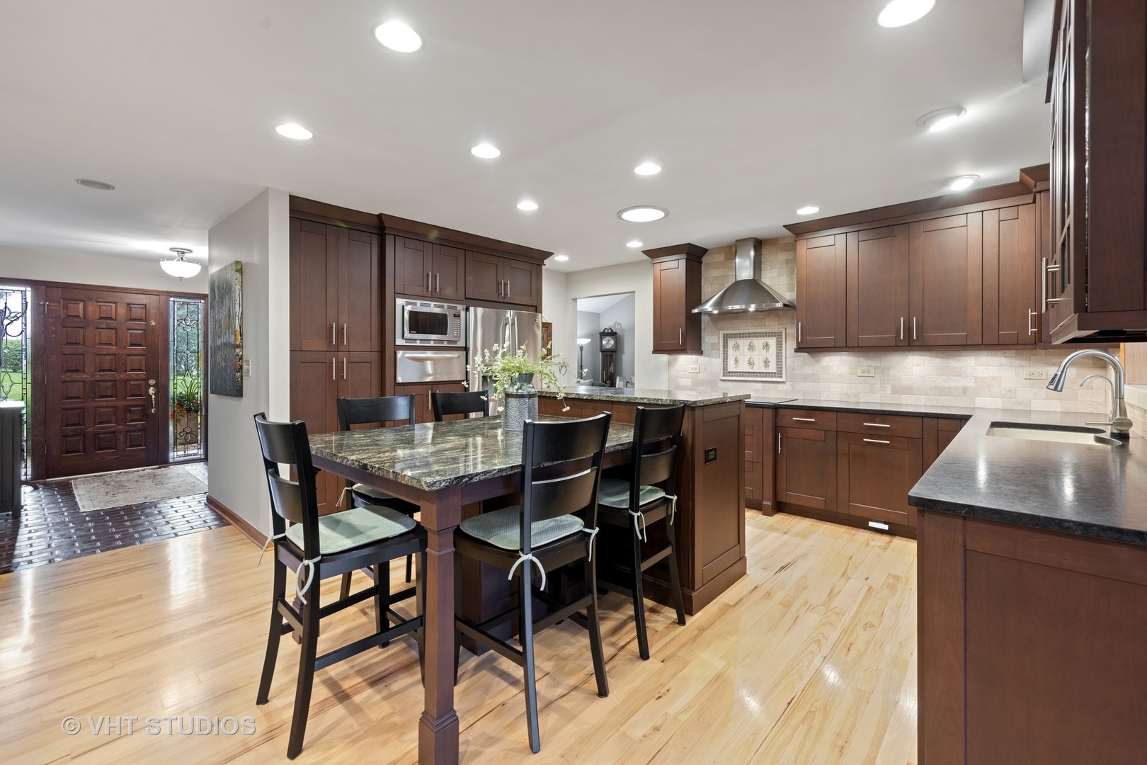 3S557 Norris Road Sugar Grove, IL 60554 - Photo 11 of 46 a kitchen with stainless steel appliances kitchen island granite countertop a sink and cabinets