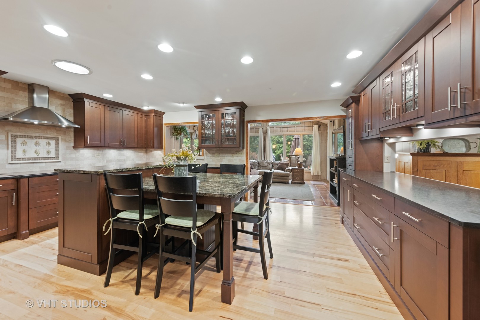 3S557 Norris Road Sugar Grove, IL 60554 - Photo 13 of 46 a kitchen with stainless steel appliances kitchen island granite countertop a table chairs and a refrigerator