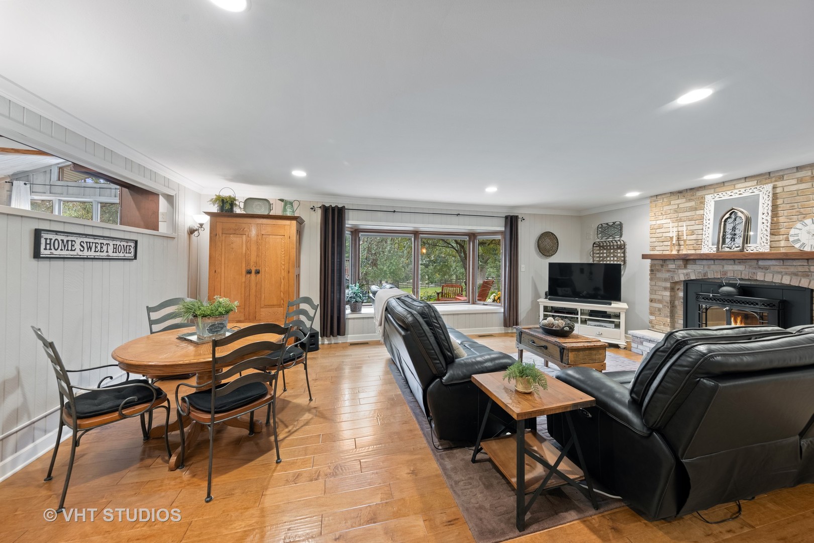 3S557 Norris Road Sugar Grove, IL 60554 - Photo 14 of 46 a outdoor space with furniture a flat screen tv and a fireplace