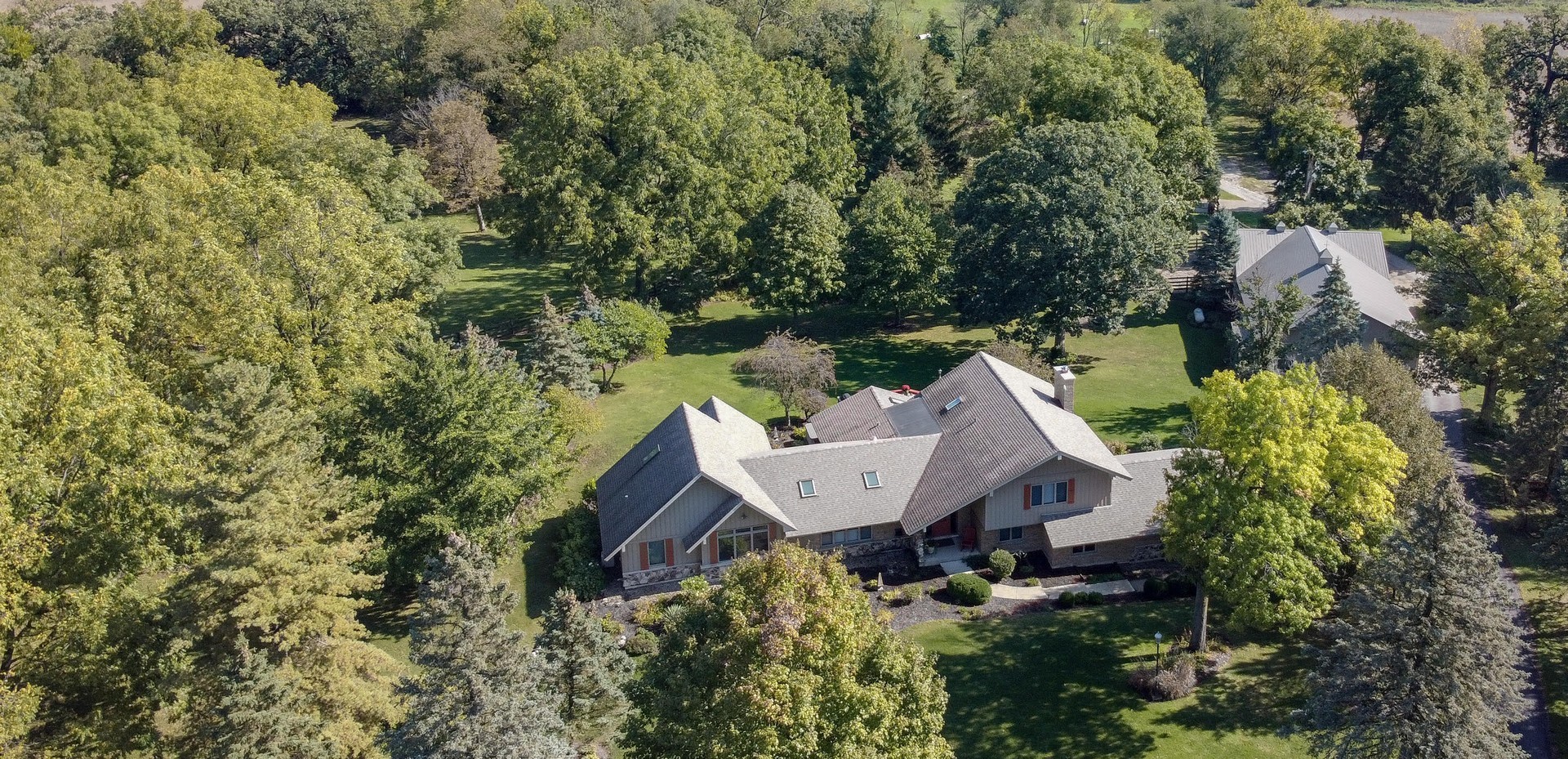 3S557 Norris Road Sugar Grove, IL 60554 - Photo 2 of 46 an aerial view of a house with yard and outdoor seating