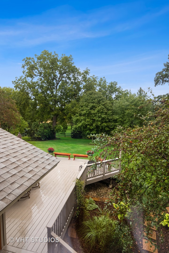 3S557 Norris Road Sugar Grove, IL 60554 - Photo 37 of 46 a view of a wooden deck with a forest