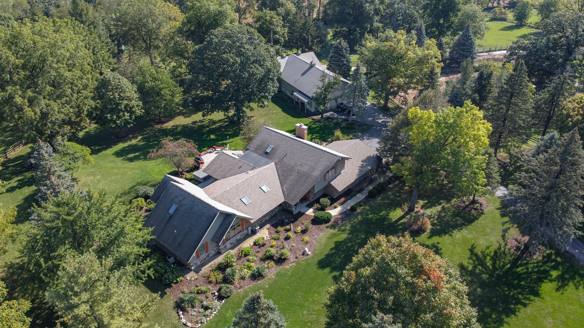 3S557 Norris Road Sugar Grove, IL 60554 - Photo 5 of 46 an aerial view of a house with a garden and trees
