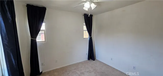 a view of a hallway with a window