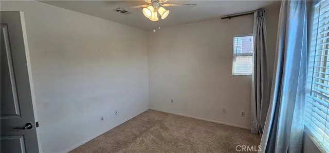 a view of a hallway with a window
