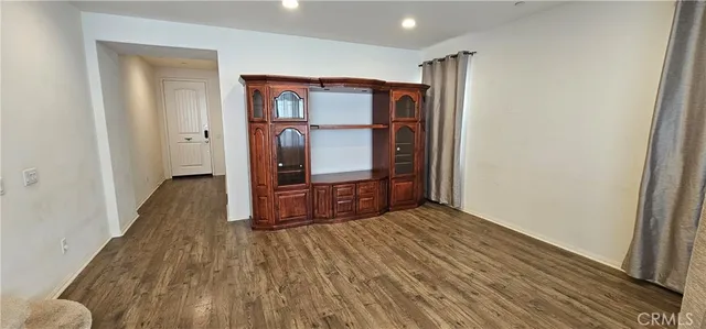 a view of hallway with wooden floor