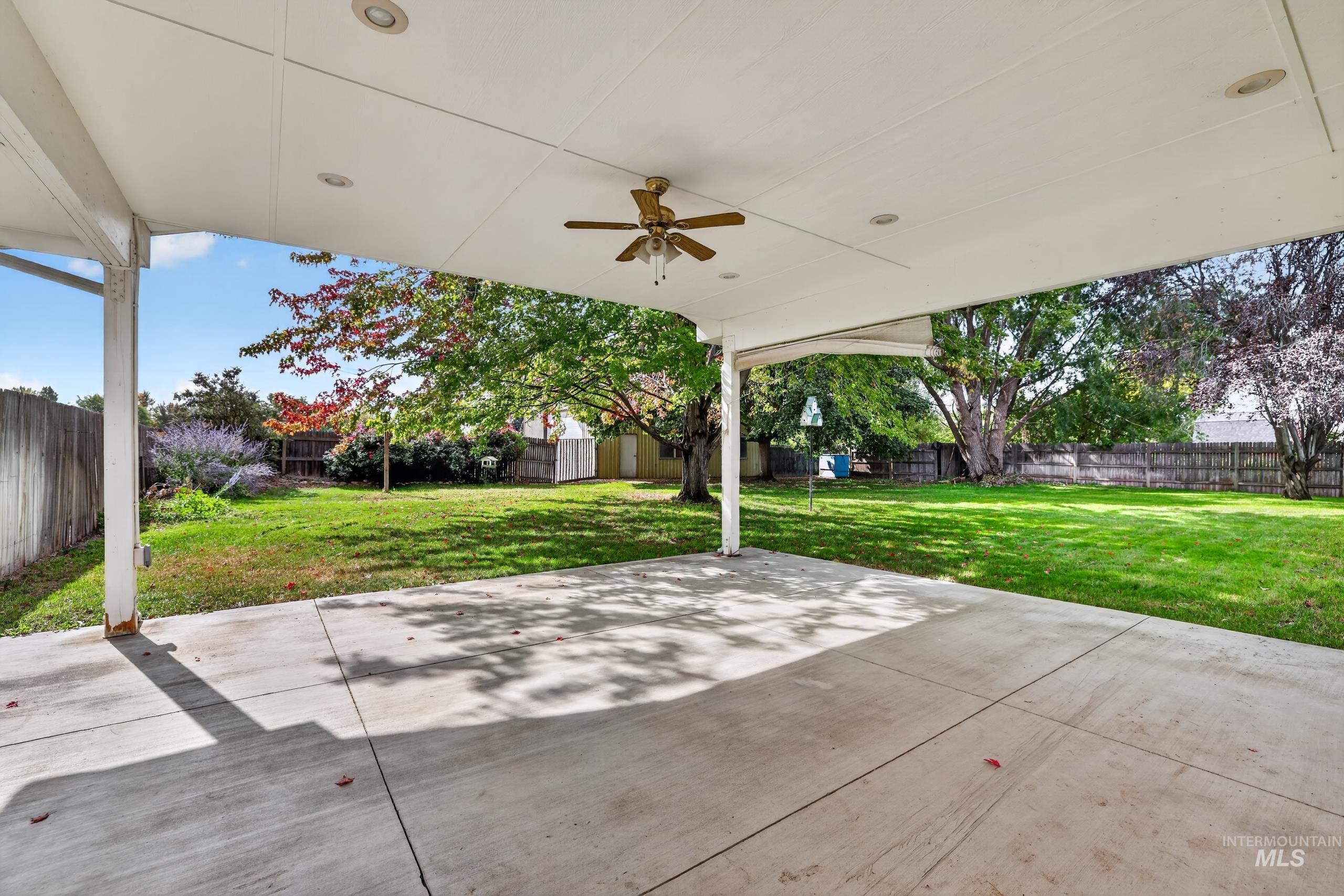 9055 West Highlander Road Boise, ID 83709 - Photo 27 of 39 Expansive covered patio with a ceiling fan and recessed lighting