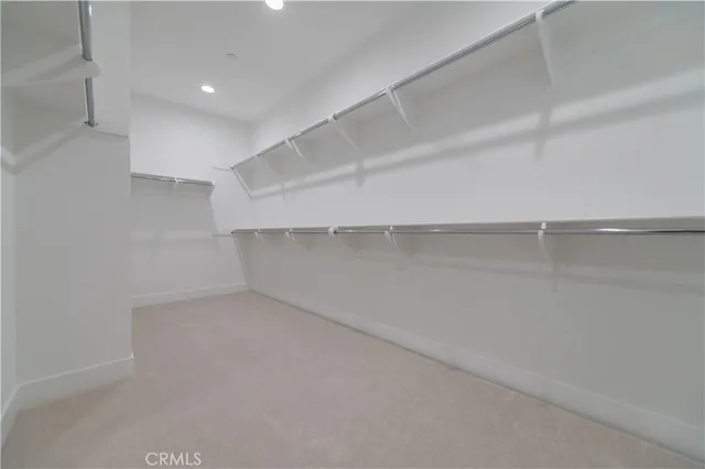 a view of an empty walk in closet