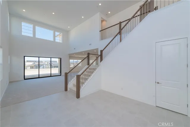 a view of entryway and hall with a front door