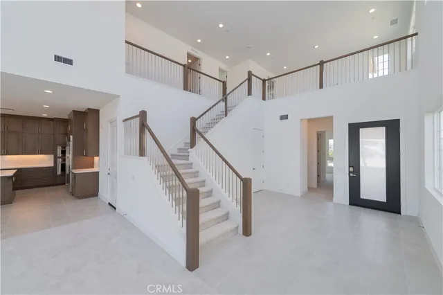 a view of a hallway with stairs