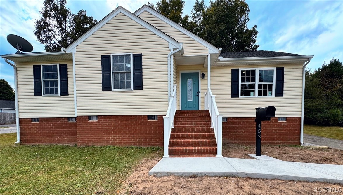 a view of a house with more windows and wooden fence