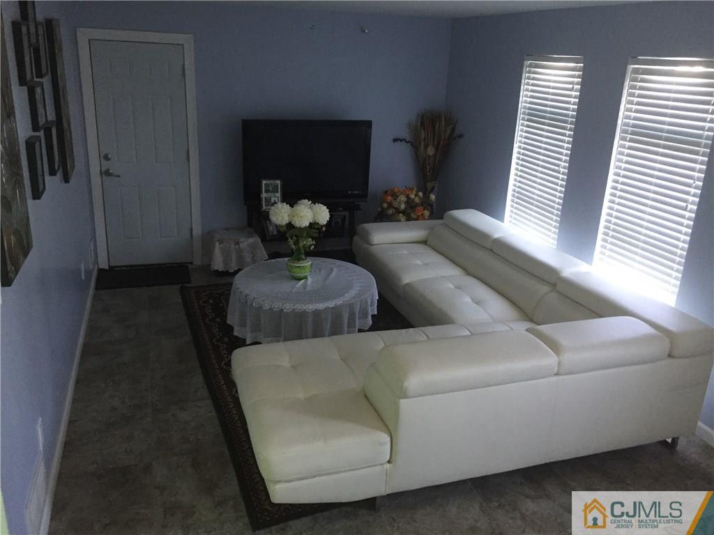47 Blair Road Carteret, NJ 07008 - Photo 3 of 23 a living room with furniture and a wooden floor