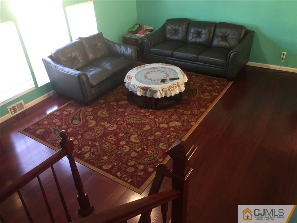 47 Blair Road Carteret, NJ 07008 - Photo 4 of 23 a living room with furniture and a wooden floor
