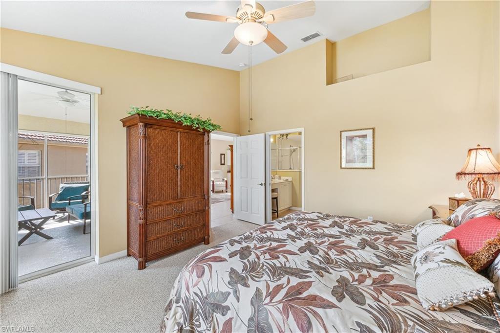 20051 Seagrove Street, Unit 1208 Estero, FL 33928 - Photo 14 of 25 a bedroom with a bed dresser and a window
