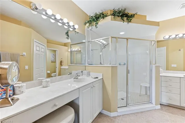 a bathroom with a double vanity sink and a mirror