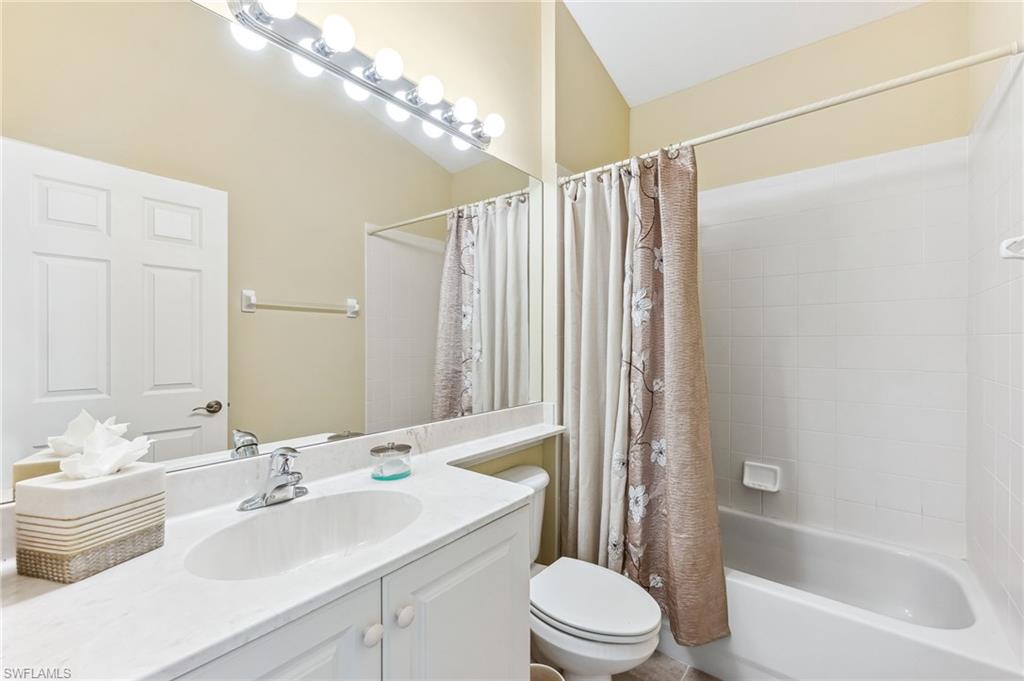 20051 Seagrove Street, Unit 1208 Estero, FL 33928 - Photo 20 of 25 a bathroom with a sink toilet and shower