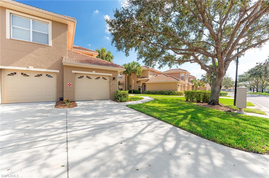 20051 Seagrove Street, Unit 1208 Estero, FL 33928 - Photo 24 of 25 a house view with a backyard space