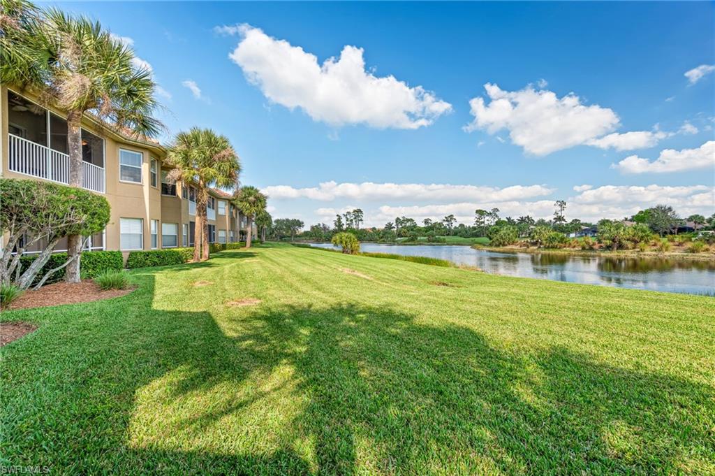 20051 Seagrove Street, Unit 1208 Estero, FL 33928 - Photo 25 of 25 a view of a lake with a big yard
