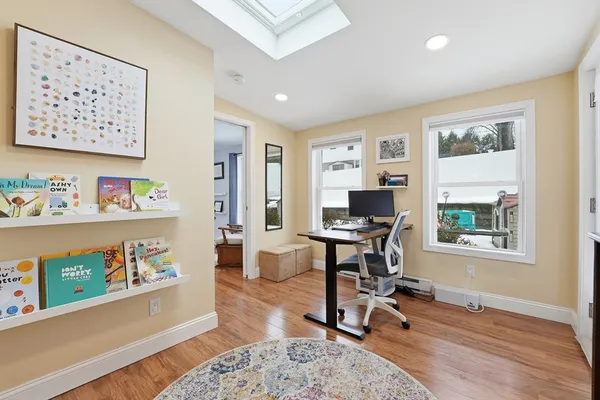 a workspace with furniture and a window