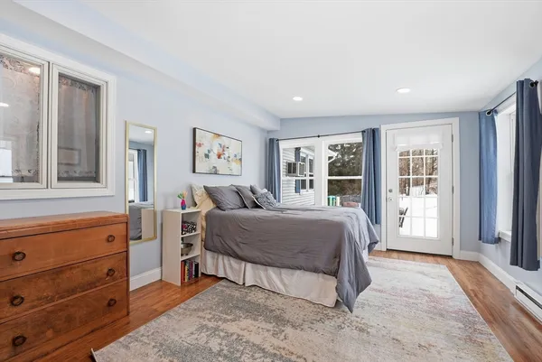 a spacious bedroom with a large bed and a window