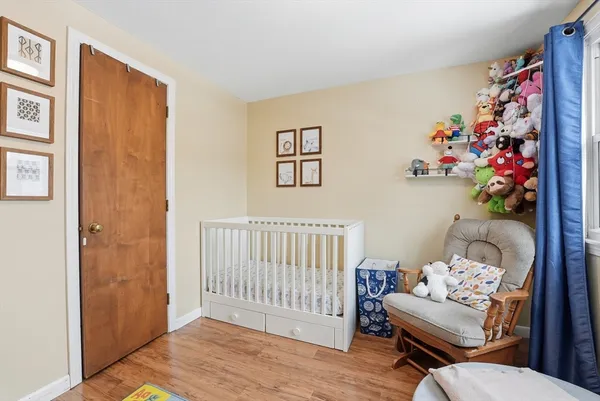a bedroom with furniture and a window