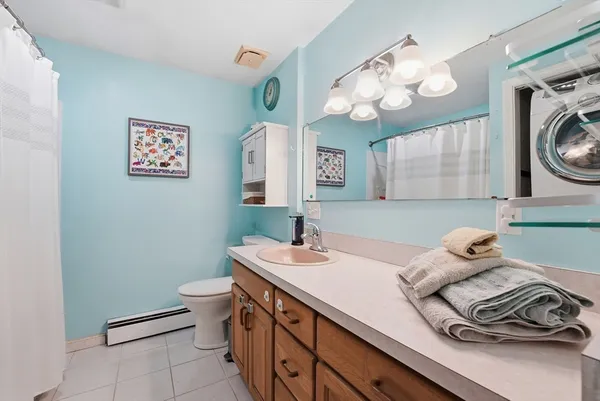 a bathroom with a sink a vanity and a mirror