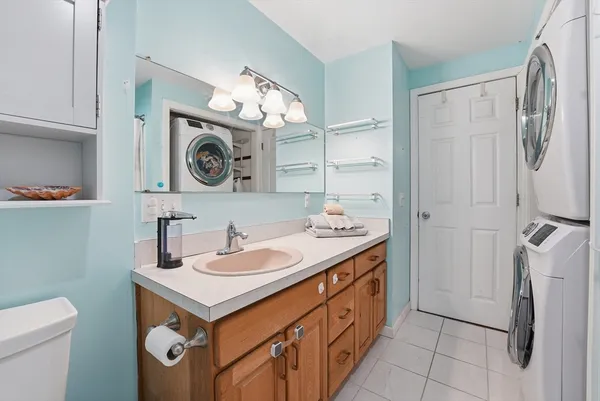 a bathroom with a sink a vanity and a mirror
