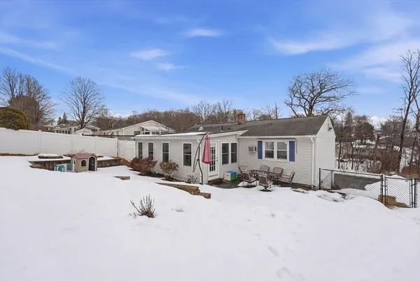 a view of a house with a snow in the background