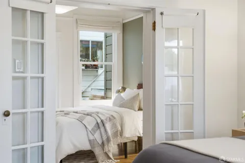 a bedroom with a bed and a table