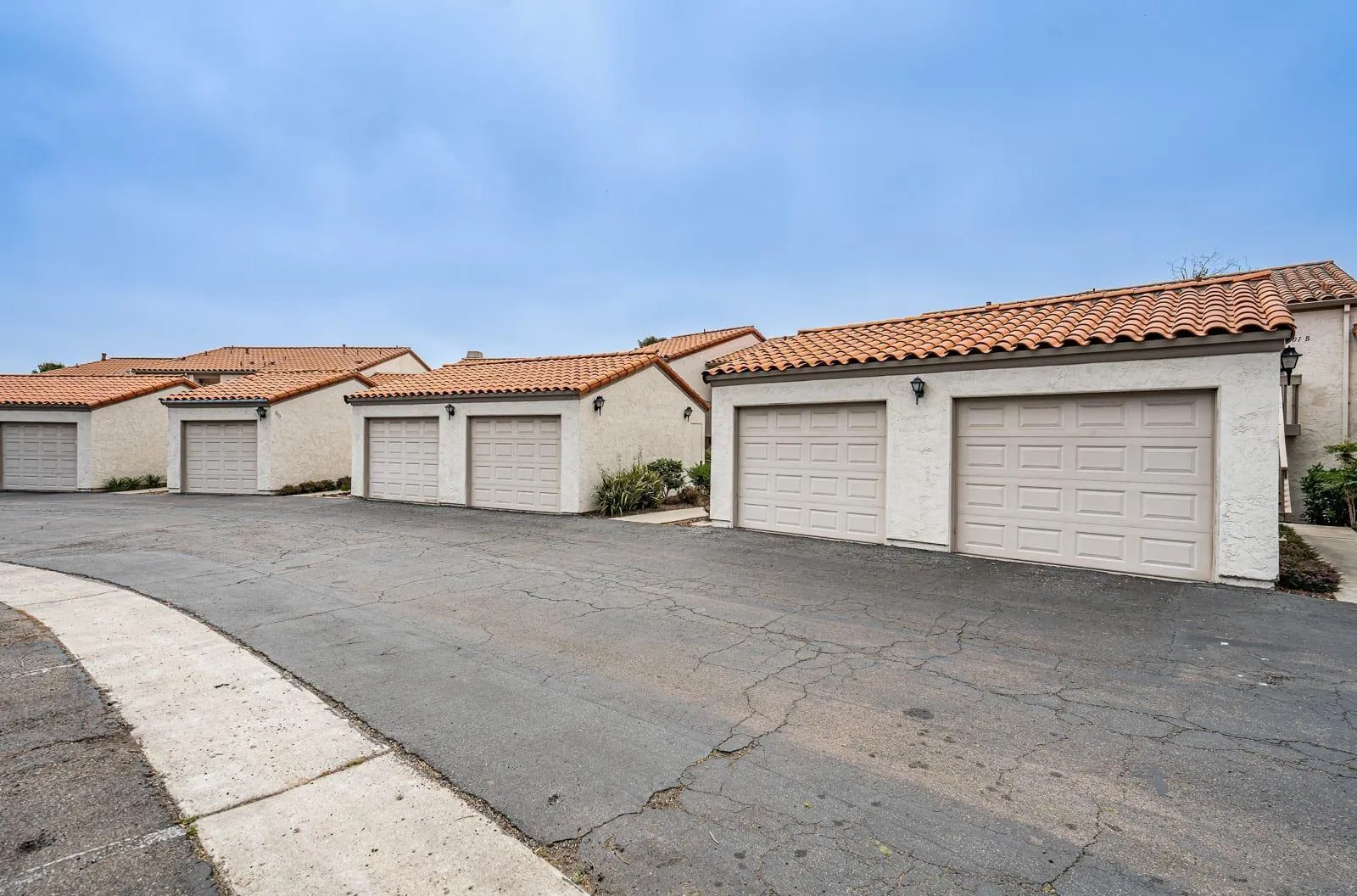 901 Caminito Madrigal, Unit E Carlsbad, CA 92011 - Photo 22 of 28 a view of a house with a garage