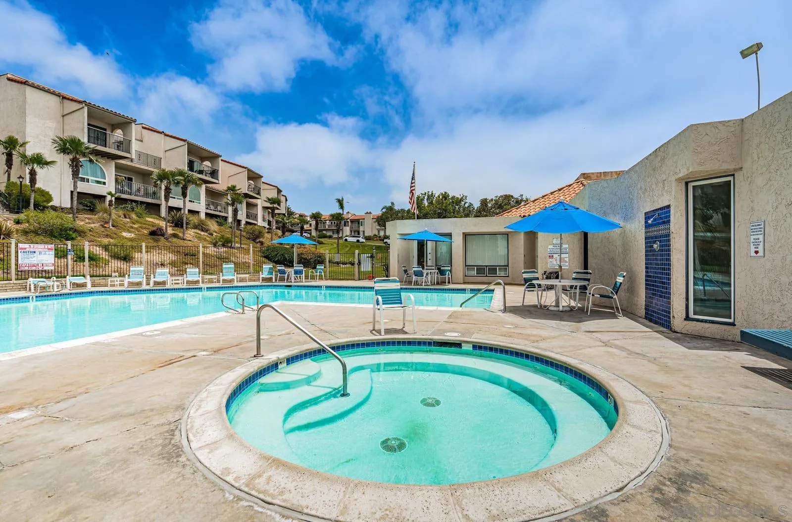 901 Caminito Madrigal, Unit E Carlsbad, CA 92011 - Photo 27 of 28 a view of a house with a swimming pool