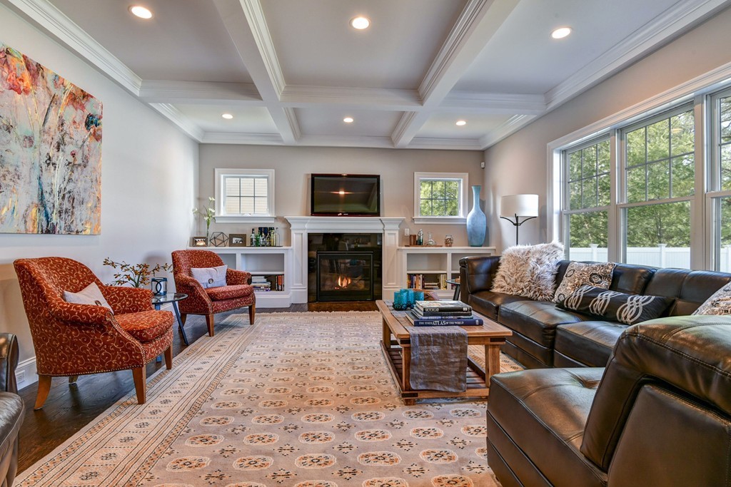 80 Evelyn Road Needham, MA 02494 - Photo 19 of 29 a living room with furniture fireplace and a large window
